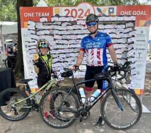 Aaron and his son completing the 24 Hours of Booty ride