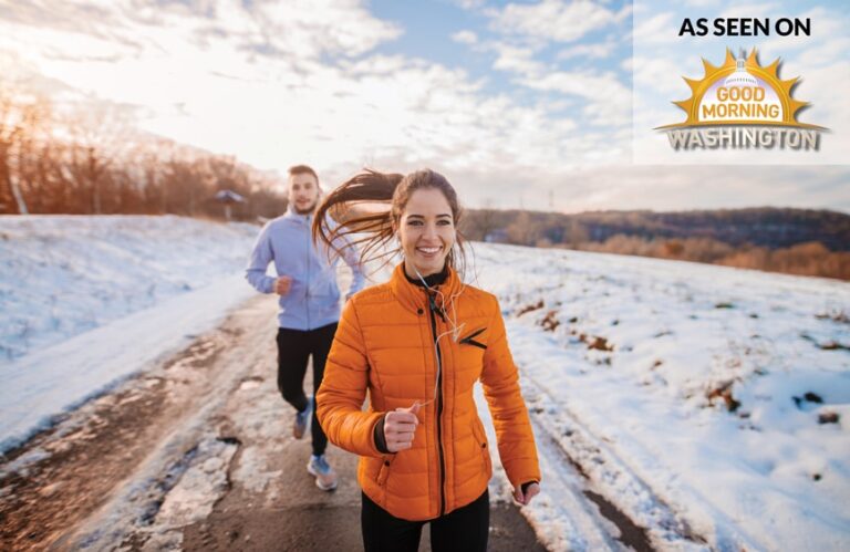 A couple running in the snow