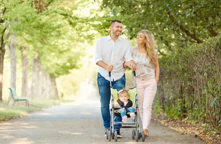 parents walking with their child