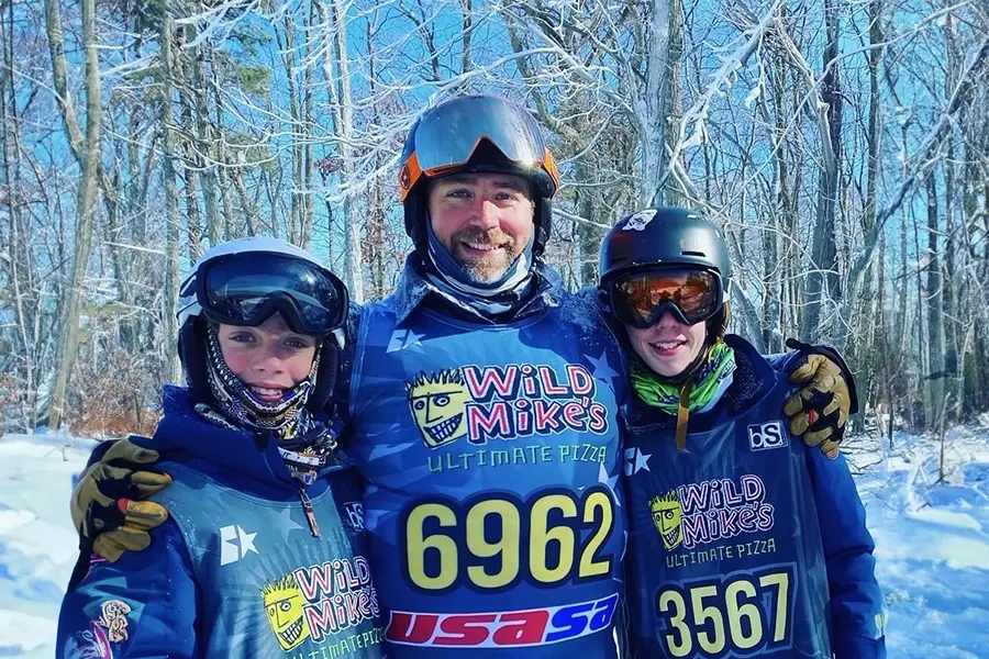 chris and his sons on the mountain