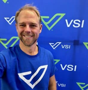 Dr. Good in front of the new VSI rebrand