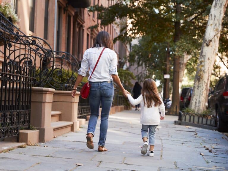 cropped, mother and daughter walking down the street, back view 901211852 3868x2578 (edited)