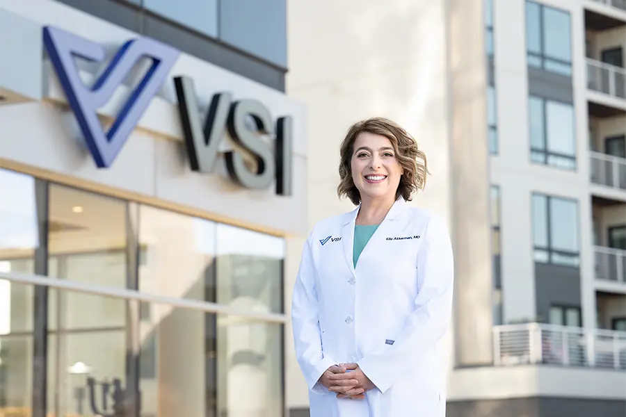 dr ella akkerman in front of vsi sign