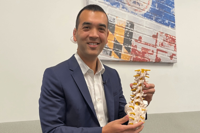 dr haines holding spine model