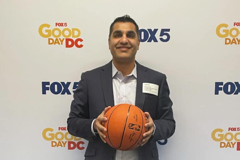 dr. bharara holding a basketball