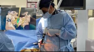 Dr. Jazini using AR headset to assist in surgery