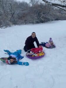 Dr. Haines with daughters in snow