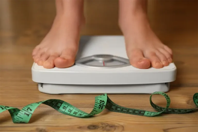 overweight girl using scales