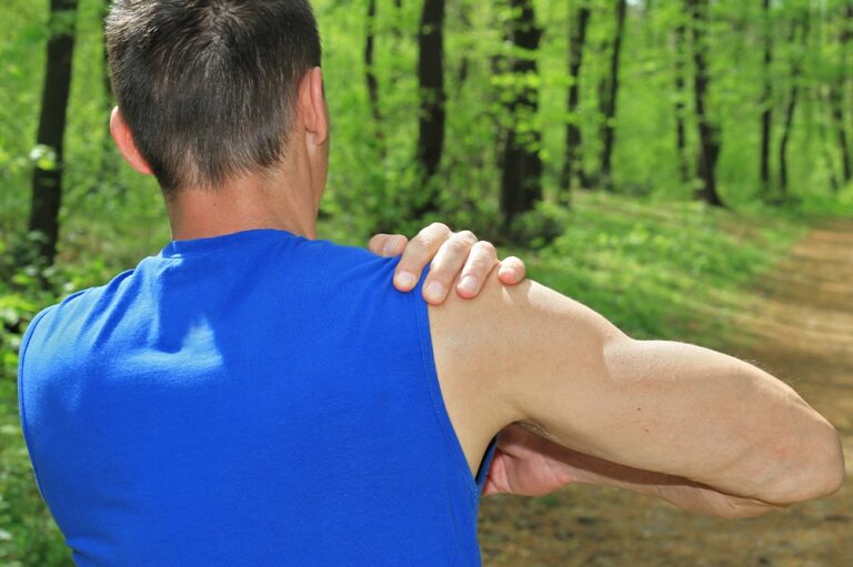 Man holding his shoulder in pain