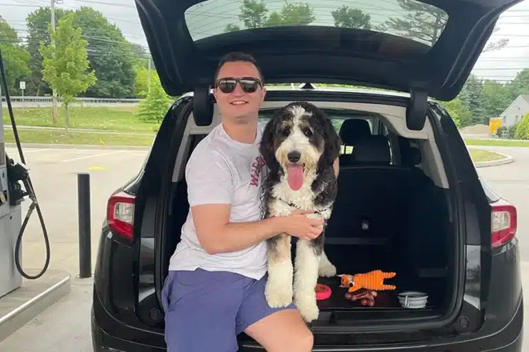 Dr. Kemp in the car with his dog quinn