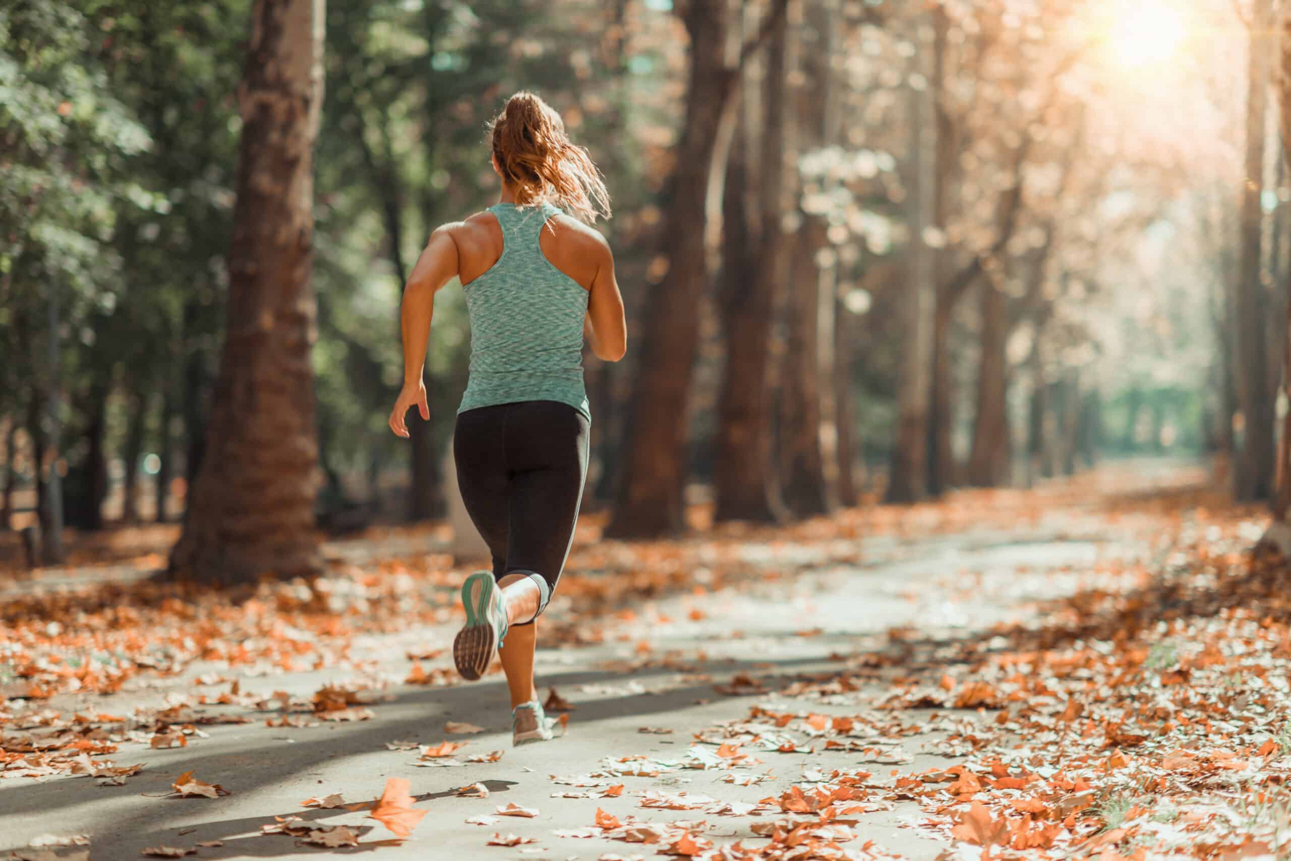 woman jogging outdoors in the fall