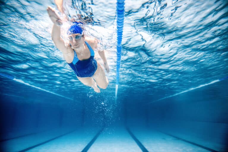 woman swimming freestyle