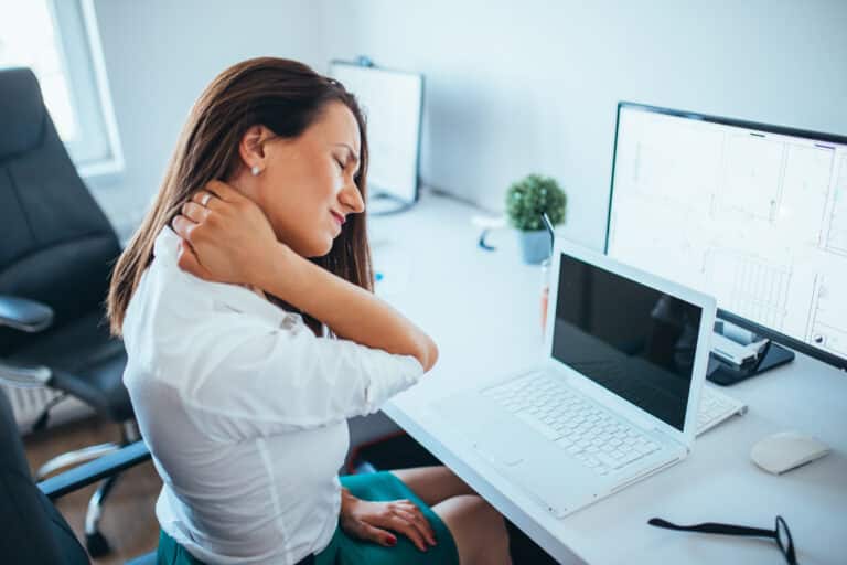 young businesswoman suffering from neckache